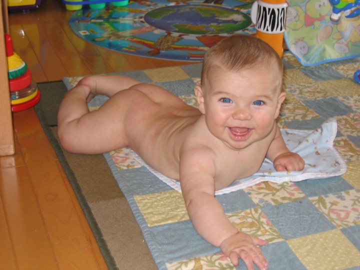 Naked Arik crawling on his belly